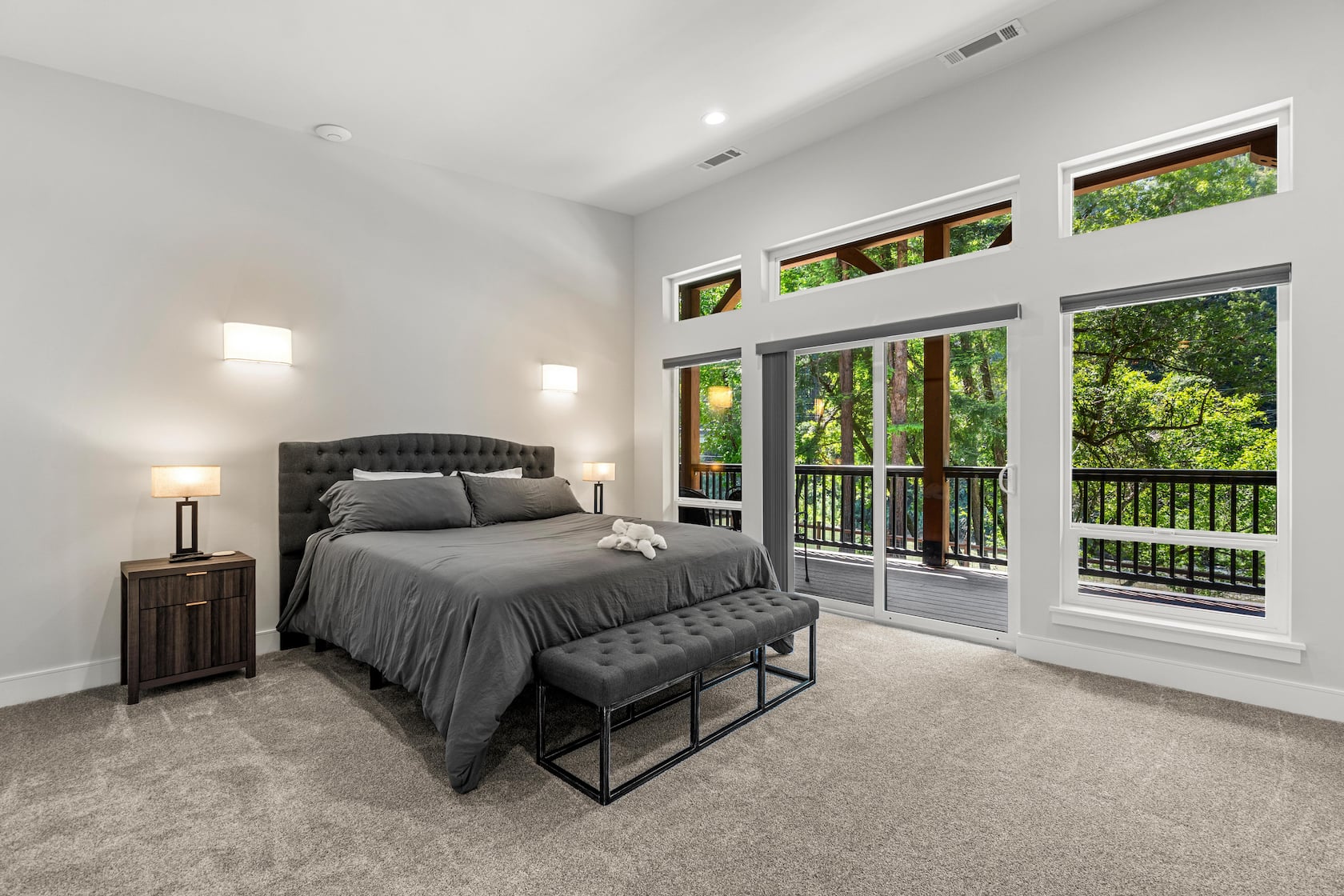 Master suite opening onto a river-view deck