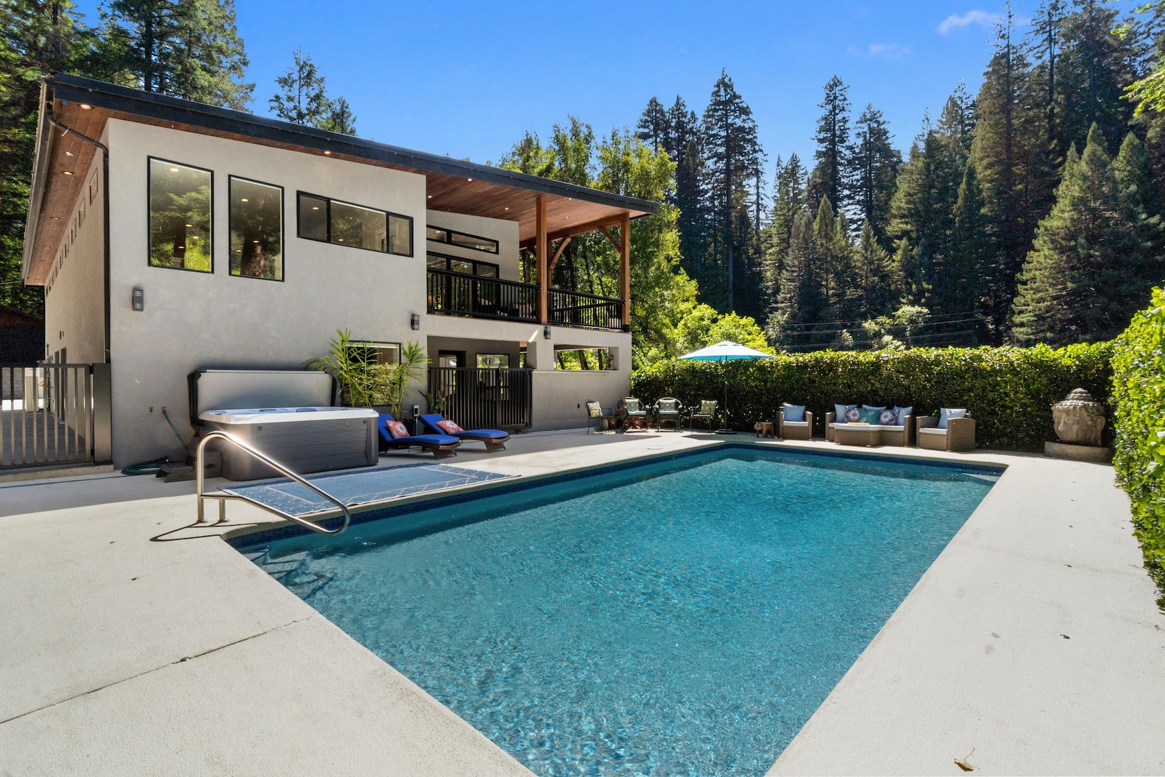 Swimming pool, spa and cedar cabana beneath the redwoods